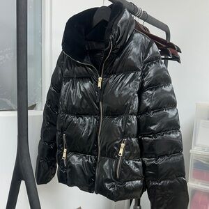 Sleek Black Puffer Jacket with Gold Accents